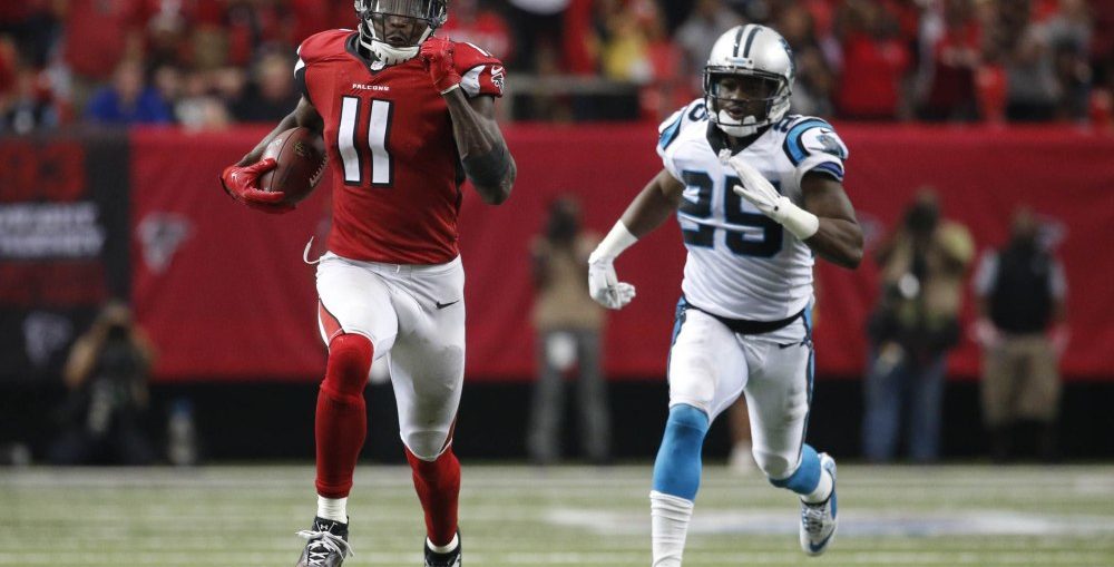 Atlanta Falcons wide receiver Julio Jones catch and run past Carolina Panthers cornerback Bene Benwikere